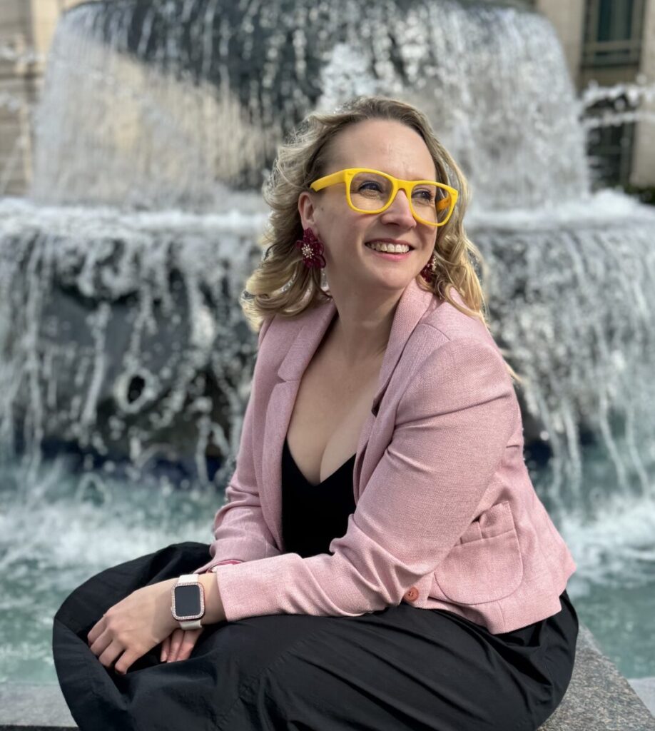Image of Kabrina Ashley sitting at fountain